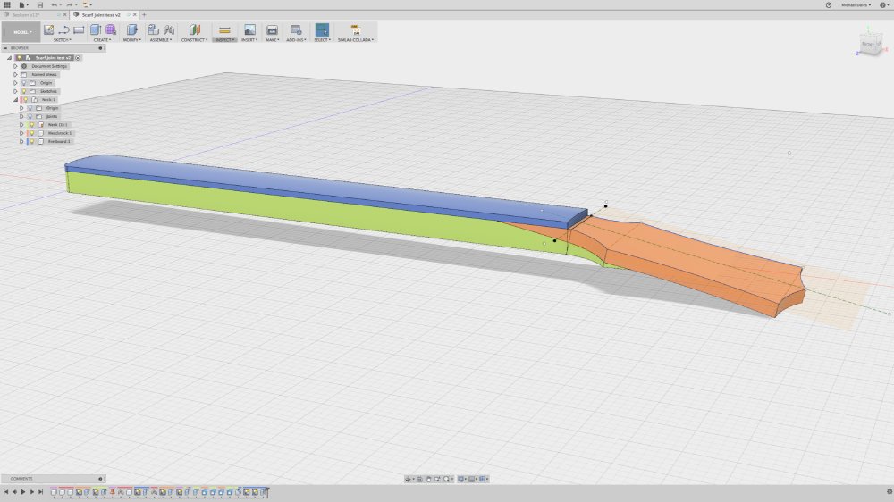 A screenshot of a CAD model of a neck with an angled headstock, using false colour to highlight how the different pieces of wood mesh together.