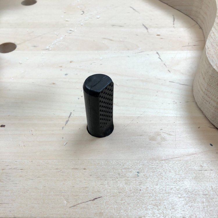 A close up picture of a bench-dog sticking out of my workbench.