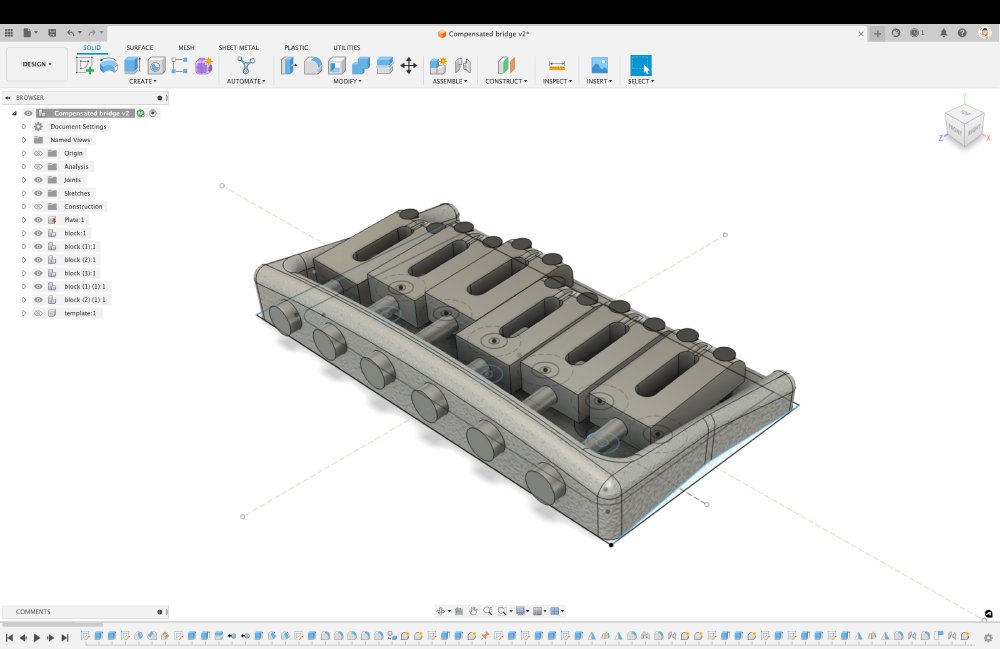 A screenshot of a CAD model for a hard-tail guitar bridge. The main observable interesting feature is that the rear wall has more of a curved sweep to it, that in fact matches the radius of the fretboard.