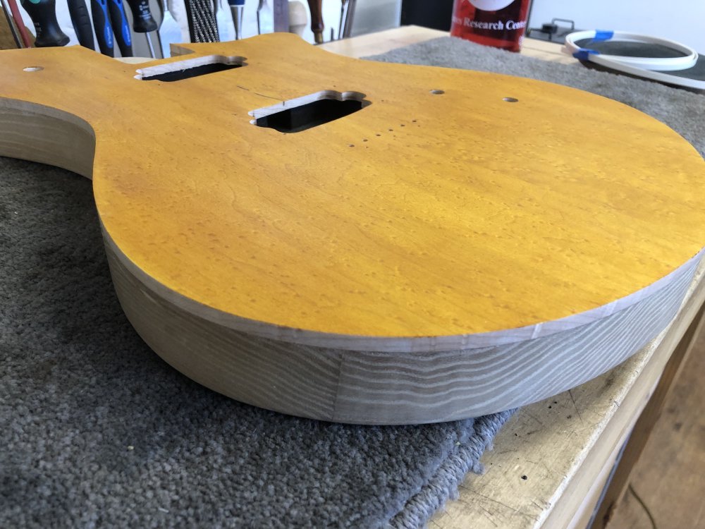 A close up on the front, showing the birds-eye maple texture in the stain. You can also see the 'natural binding' along the top edge that is the maple cap's depth, on top of the poplar body.