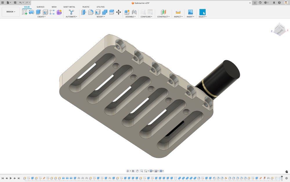 A screenshot of  some CAD software showing the same design as before, but from the underside. This reveals the six channels in which the little slides go that run the entire length of the block, meaning it is mostly hollow underneath.