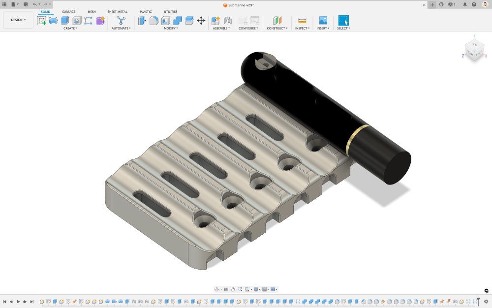 A screenshot of some CAD software showing a design for a single super block that is made out of fusing together the 6 lozenge shaped blocks from the photo and filling in the gaps between them.