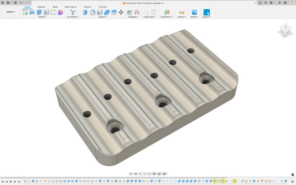 A screenshot of the simplied bridge part - the slots from before are gone, and there are now 6 fixed position screw holes to mount the top part of the bridge.